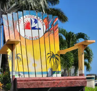 a colorful bench with a palm tree on it at Most Unique Space in Fort Lauderdale