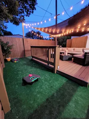 a backyard with a deck with lights and a table at Most Unique Space in Fort Lauderdale