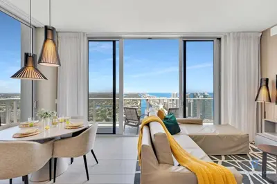 a living room with a couch and a table at Luxury Penthouse -Awesome Views-Pools - Free Parking in Hollywood