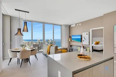 a kitchen and living room with a view of the ocean at Luxury Penthouse -Awesome Views-Pools - Free Parking in Hollywood