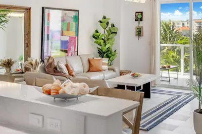 a living room with a couch and a table at Lux 3BR City-View Retreat in Hollywood, 4th Floor in Hollywood