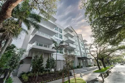 an exterior view of a white apartment building at Lux 3BR City-View Retreat in Hollywood, 4th Floor in Hollywood