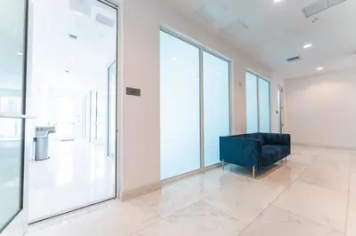 a black couch in a room with large windows at Lux 3BR City-View Retreat in Hollywood, 4th Floor in Hollywood