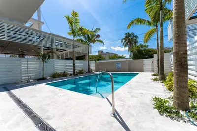 a swimming pool in the backyard of a house at Lux 3BR City-View Retreat in Hollywood, 3rd Floor in Hollywood