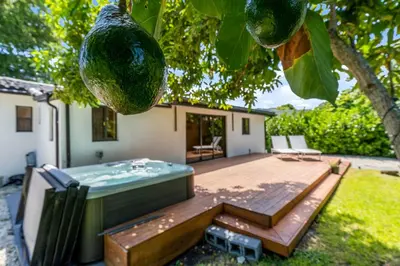 a house with a hot tub in a yard at Casa Siesta- Hot tub Home Gym and Modern Design in Miami