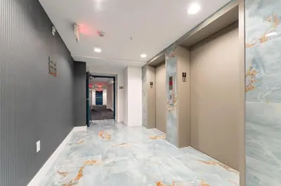 a hallway with a painting on the wall at Lux 3BR City-View Retreat in Hollywood, 2nd Floor in Hollywood