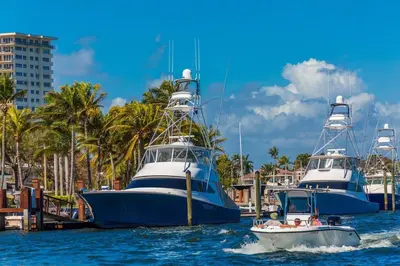 two boats are docked in the water in a harbor at 1 Block from the Beach 2BR 2BA Newly Renovated in Fort Lauderdale