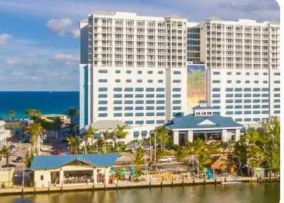 a view of a city with tall buildings and the ocean at Coastal Haven 5 Min to Beach, Patio, BBQ in Dania Beach