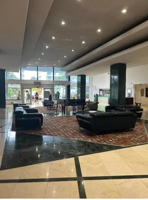 a lobby with couches and tables in a building at Casablanca miami beach in Miami Beach