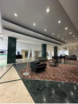 a lobby with a couch and a piano in a building at Casablanca miami beach in Miami Beach