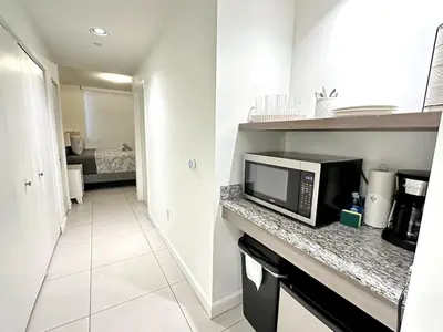 a kitchen with a microwave on a counter at Doral Studio with Fabulous View in Miami