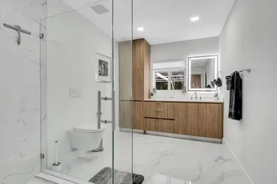 a bathroom with a shower and a toilet and a sink at Villa Oasis with Heated Pool,Sauna, BBQ and Pool Table in Pinecrest