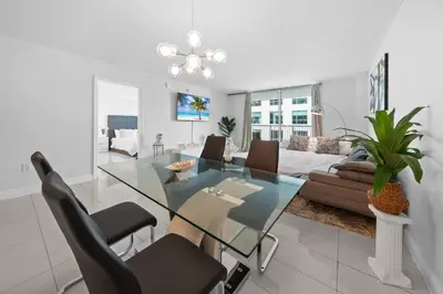 a living room with a glass table and a couch at 36th-Floor Ocean View Brickell - Free Parking in Miami