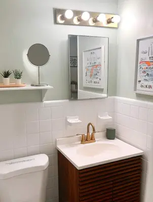 a bathroom with a sink and a mirror and a toilet at Peaceful Casita near Hollywood Beach & essentials in Hollywood