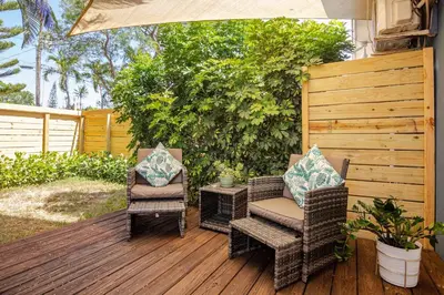 two chairs and a table on a wooden deck at Peaceful Casita near Hollywood Beach & essentials in Hollywood