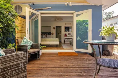 a patio with a table and chairs and a room at Peaceful Casita near Hollywood Beach & essentials in Hollywood