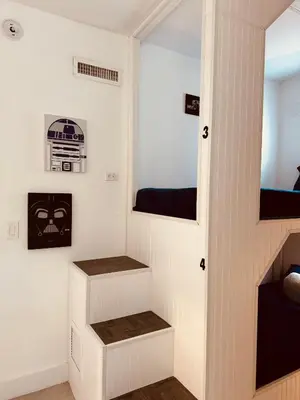a room with two bunk beds and two stairs at Miami Design District in Miami