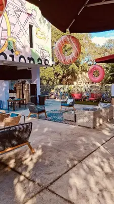 a group of benches sitting in front of a building at Miami Design District in Miami