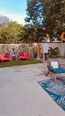 a group of chairs sitting in a park at Miami Design District in Miami