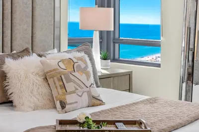 a bedroom with a bed with a view of the ocean at Oceanview Private Condo at The Setai -2604 in Miami Beach