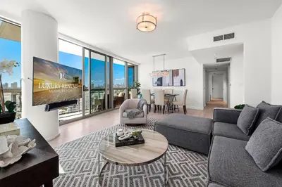 a living room with a couch and a table at Oceanview Private Condo at The Setai -2604 in Miami Beach