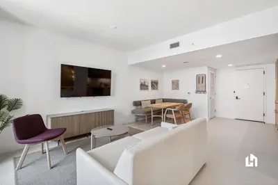 a living room with a couch and a table at Stylish Apartments with Partial Ocean Views in Downtown! in Miami