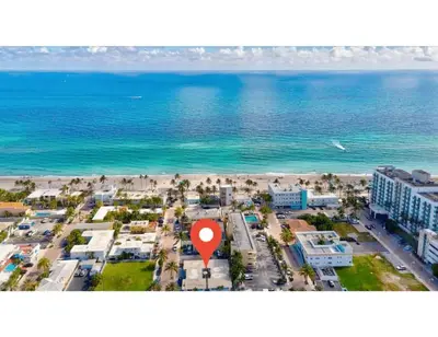 an aerial view of a beach with a red marker at Sunset Bliss Hollywood Seaside Studio Retreat in Hollywood