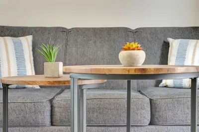 a living room with a couch and a table at Sunset Bliss Hollywood Seaside Studio Retreat in Hollywood