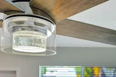 a light hanging from the ceiling of a kitchen at Sun kissed Charm Beachside Hollywood Studio in Hollywood