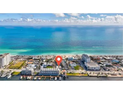 an aerial view of a beach with a red marker at Seaside Serenity Hollywood Studio Escape in Hollywood