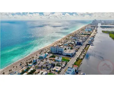 an aerial view of a beach and the ocean at Studio Oasis near Hollywood Boardwalk in Hollywood