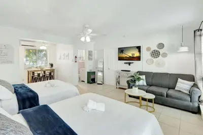 a living room with two beds and a couch at Hollywood Beach Escapade Studio with Free Parking in Hollywood