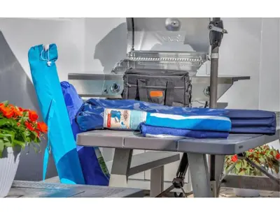 a table with a blue blanket on top of it at Sunny Serenity Hollywood Studio Getaway in Hollywood