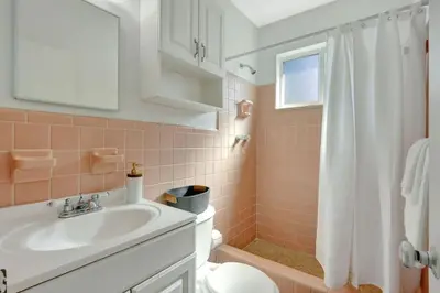 a bathroom with a sink and a toilet and a shower at Beachside Bliss Hollywood Studio in Hollywood