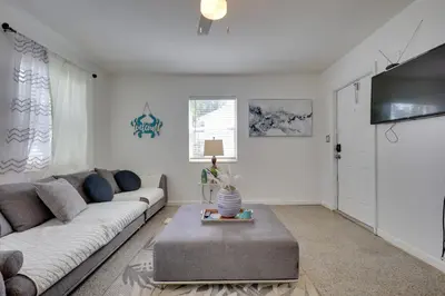 a living room with a couch and a tv at 3 Mi to Beach Quaint Home with Patio in Hollywood in Hollywood