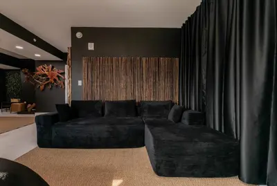a living room with a black couch and curtains at MIAMI WOOD APART HOTEL NEW 2024 - PRIVATE TERRACE - free GARAGE - Beach 5 min in Hollywood