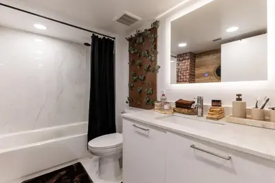 a white bathroom with a toilet and a sink at MIAMI WOOD APART HOTEL NEW 2024 - PRIVATE TERRACE - free GARAGE - Beach 5 min in Hollywood