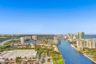 an aerial view of a city with a river at Penthouse Sky Suite - 2BDR2BTH - Private Rooftop Terrace in Hallandale Beach