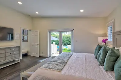 a large bedroom with a bed and a television at Gorgeous Las Olas - Heated Pool, Close to Beach in Fort Lauderdale