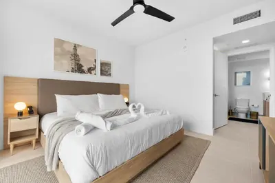 a bedroom with a bed with towels on it at Luxury Panoramic Views - The Ultimate Downtown Getaway in Miami