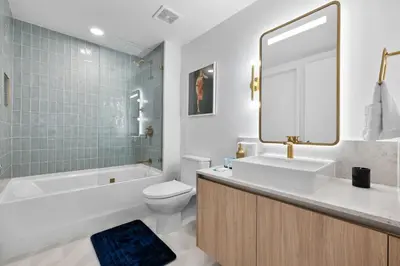 a bathroom with a sink and a tub and a toilet at Luxury Panoramic Views - The Ultimate Downtown Getaway in Miami