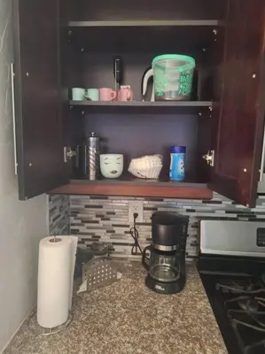 a kitchen with a coffee maker on a counter at Heated Pool Private Duplex House, BBQ, Parking, WiFi in Cutler Bay