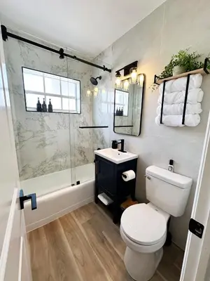 a bathroom with a toilet and a sink and a shower at AQUAMARIA HOME - perfect stay for groups in Fort Lauderdale