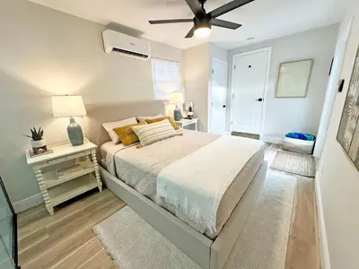 a bedroom with a bed and a ceiling fan at AQUAMARIA HOME - perfect stay for groups in Fort Lauderdale