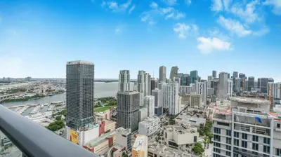 an aerial view of a city with tall buildings at 49th Floor Sleek Condo Cozy Pool, Gym and Spa Stay in Miami