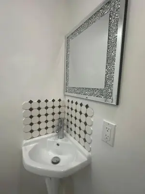 a bathroom with a sink and a mirror at Relaxing Studio Getaway w BBQ, Patio and Parking in Pembroke Pines