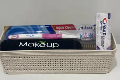 a basket filled with toothbrushes toothpaste and tooth paste at Relaxing Studio Getaway w BBQ, Patio and Parking in Pembroke Pines
