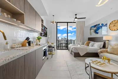 a kitchen and living room with a couch and a bed at PH 49 Floor Luxury Studio w Free Parking in Miami
