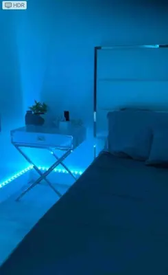 a blue room with a couch and a table at Beach Getaway in Hollywood