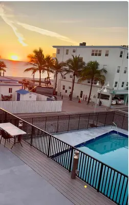 a view of the pool from the balcony of a apartment at Beach Getaway in Hollywood